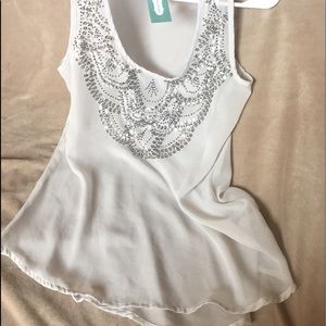 Comfy sheer tank with sparkle details.